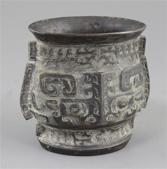A Chinese archaic bronze ritual wine cup, Zhi, late Shang/early Western Zhou dynasty, 11th century B.C., 12.5cm, rim probably altered